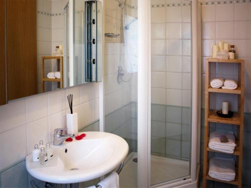 a bathroom with a sink and a shower at Bed And Breakfast 22 Garibaldi Home in Riccione
