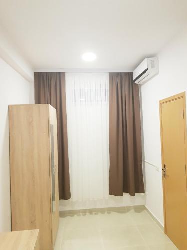 a room with a door and a window at Ema in Vama Veche