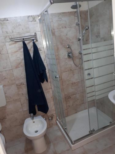 a bathroom with a shower and a toilet at B&B RELAX in Messina