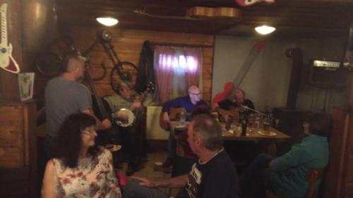 a group of people sitting in a room at Dřevěnka in Provodín