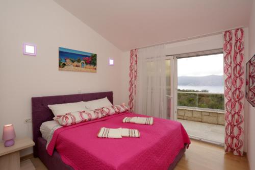 En eller flere senge i et værelse på Luxury Villa Lidija