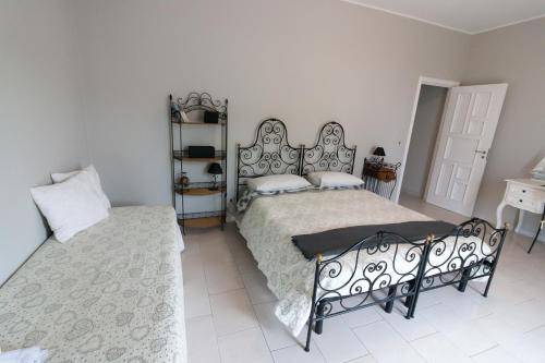 Postel nebo postele na pokoji v ubytování Sottovento B&B