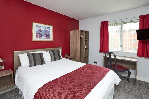 A bed or beds in a room at Yarnfield Park Training And Conference Centre