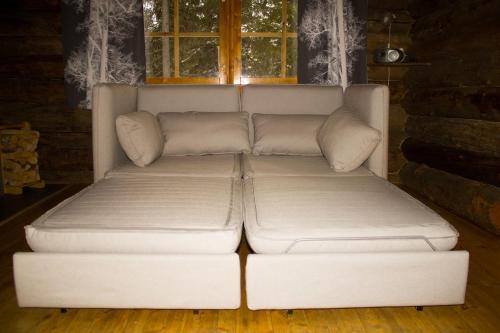 Un pat sau paturi într-o cameră la Mäntyrinne