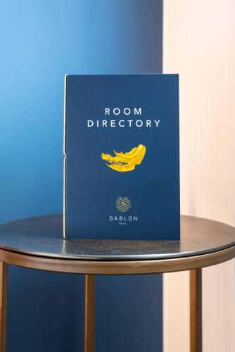 a book sitting on top of a table at Boutique Hotel Sablon by CW Hotel Collection in Bruges