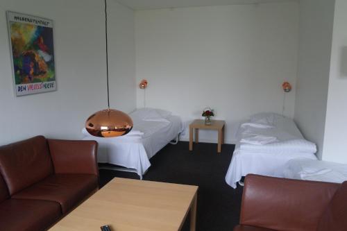 Postel nebo postele na pokoji v ubytování Emmaus Hostel