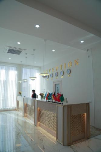 a lobby with a reception desk in a building at Hotel Uzbekistan in Urganch