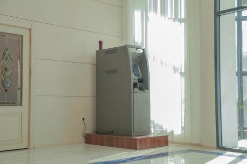 a machine sitting in a room next to a window at Hotel Uzbekistan in Urganch