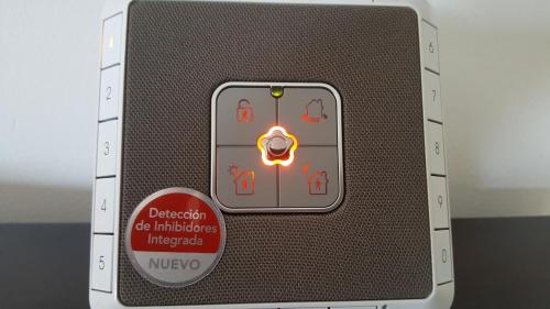 a remote control with a danger sign on it at The Apartment in Gran Tarajal