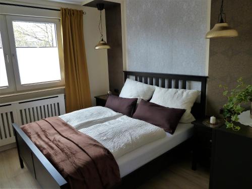 מיטה או מיטות בחדר ב-Randersacker