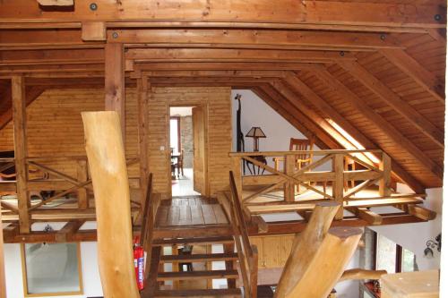 an overhead view of a staircase in a log cabin at Magtár Vendégház Harsány in Harsány
