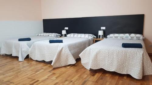 Cama o camas de una habitación en Cantares-NOJA ROOMS