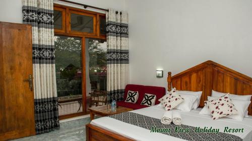 En eller flere senger på et rom på Mount View Holiday Resort