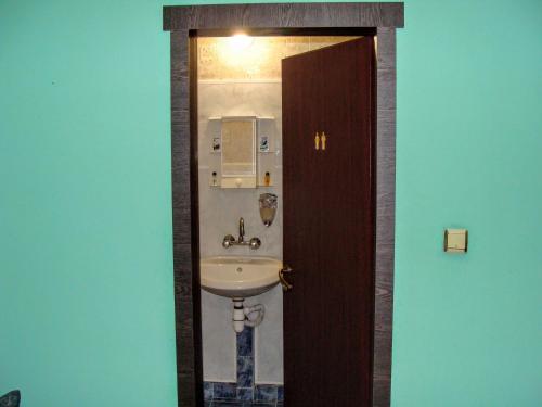 a bathroom with a white sink in a room at Апартамент за гости"Вълчанови" in Elkhovo