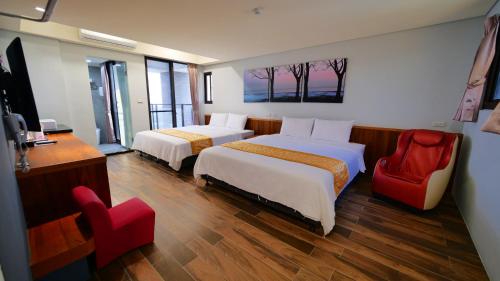 Un pat sau paturi într-o cameră la Apause Hotel