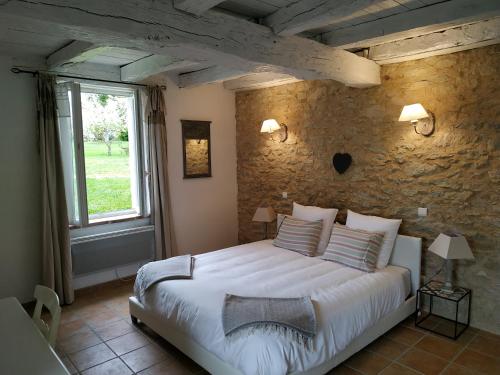 Rúm í herbergi á Bastide De Luzert