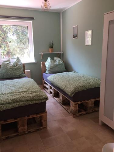 Postel nebo postele na pokoji v ubytování Ferienhaus LOOP IN