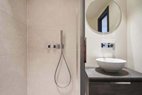 a bathroom with a shower with a sink and a mirror at 3P BETWEEN CROISETTE BEACHES AND ANTIBES STREET in Cannes