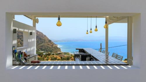 a house with a view of the ocean at Galini Breeze in Agia Galini