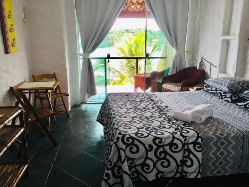 Cama ou camas em um quarto em Pousada Casa Atlântica