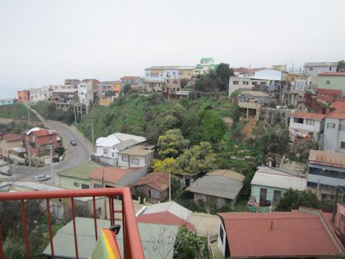 a view of a town with houses and a road at El Mirador De Valparaiso in Valparaíso