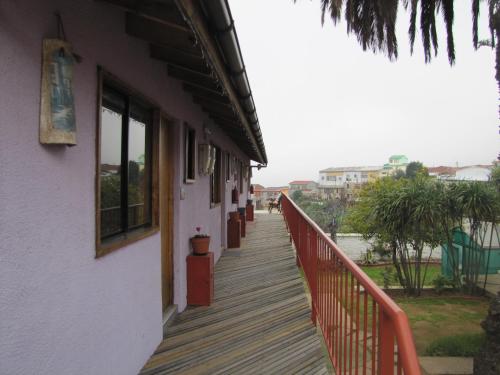 a wooden walkway leading down to a building at El Mirador De Valparaiso in Valparaíso