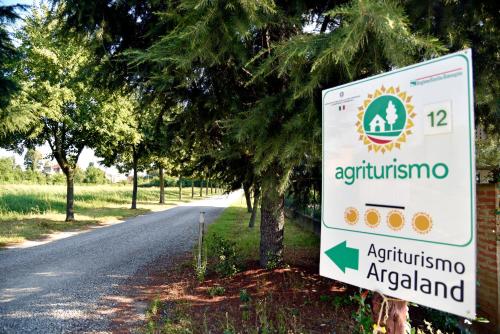 a sign for an agriculture argentina on the side of a road at Agriturismo Argaland in Parma