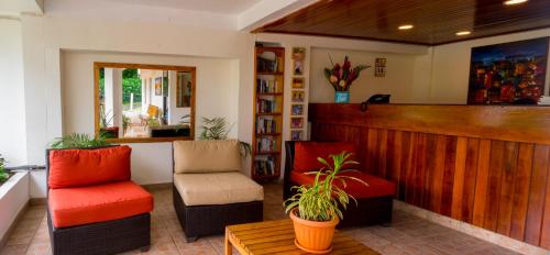 a barber shop with two chairs and a counter at Siesta Hotel in Morne Rouge