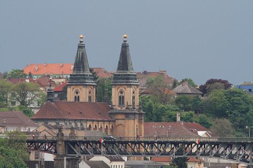 a large building with two towers and a bridge at Apartmán pod rozhlednou in Roudnice nad Labem