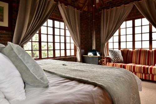 Een bed of bedden in een kamer bij De Ark Mountain Lodge