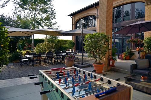 a foosball table in front of a house at Agriturismo Argaland in Parma