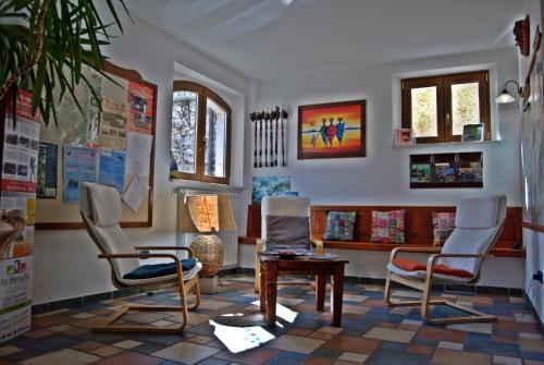 a room with three chairs and a table at Casa Hotel Civitella in Civitella Alfedena