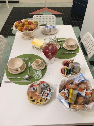 a table with plates and bowls of food on it at Il Frantoio 1937 in Terlizzi