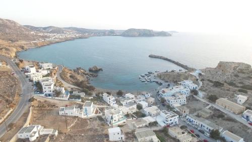 an aerial view of a town with a body of water at Finiki Studios in Karpathos Town