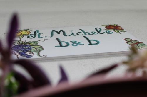 a sign with the words it michael best on a wall at St. Michele b&b in Patti