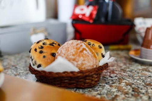two loaves of bread in a basket on a counter at St. Michele b&b in Patti