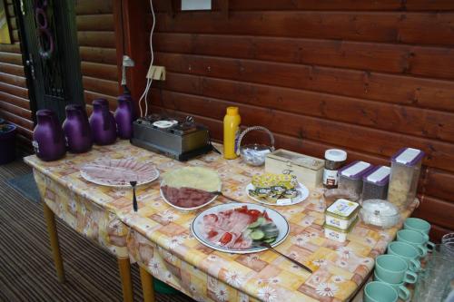 a table with plates of food on it at Letní rekreační středisko Schiffler Miroslav in Samopše