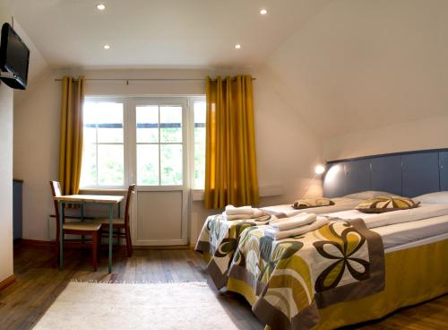 מיטה או מיטות בחדר ב-Arno Apartments