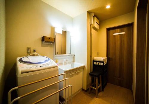 a small bathroom with a sink and a mirror at Kyoto - House / Vacation STAY 3816 in Kyoto
