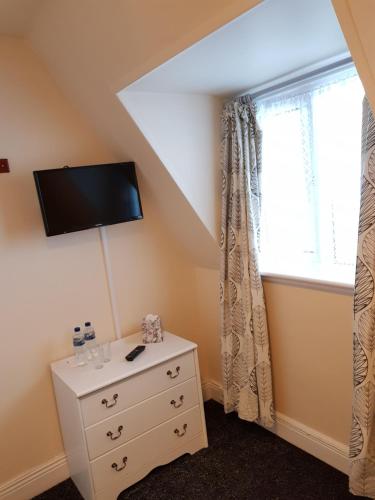 TV a/nebo společenská místnost v ubytování Billycan Guest Rooms
