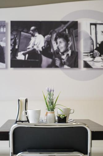 a table with a plant sitting on top of it at Le Due Sicilie B&B in Lascari