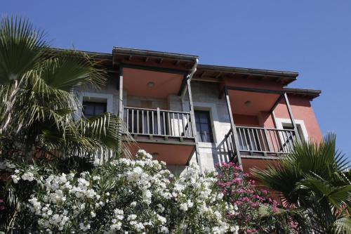a building with flowers in front of it at Mer in Fethiye