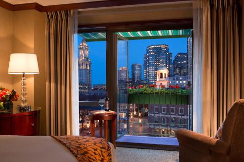 a hotel room with a view of the city at The Bostonian Boston in Boston