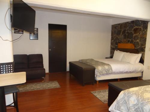 Кровать или кровати в номере Regis Hotel Boutique