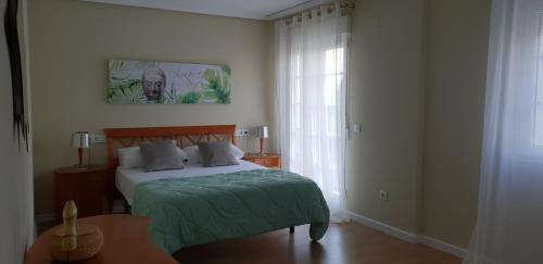 Postel nebo postele na pokoji v ubytování Rey Don Jaime