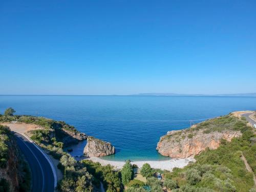 a view of the ocean and a road at Paradeisos in Kardamili