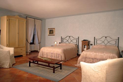 Ένα ή περισσότερα κρεβάτια σε δωμάτιο στο Agriturismo Macesina