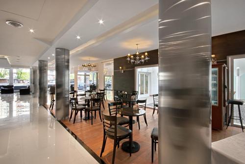 
a large kitchen with stainless steel appliances and stainless steel appliances at Hotel Nuevo Ostende by bund in Mar del Plata
