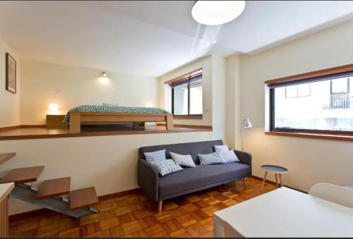 a living room with a couch and a bed at Studio 312 - With Free Parking in Porto