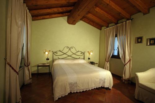 Postel nebo postele na pokoji v ubytování Agriturismo Macesina